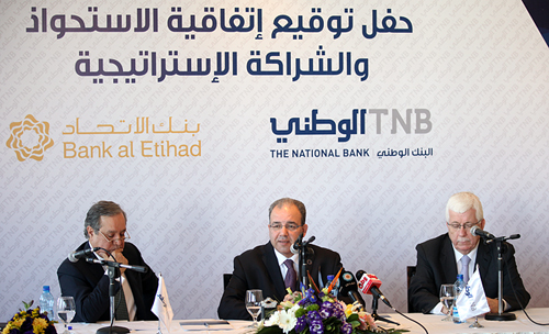 توقيع اتفاقية شراكة استراتيجية بين البنك الوطني وبنك الاتحاد الاردني